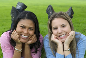 stock photo of two girls on a lawn
